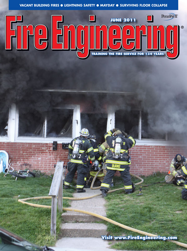 Companies in Camden, New Jersey, arrived to find a heavy fire condition on the first floor of this two-story row house.