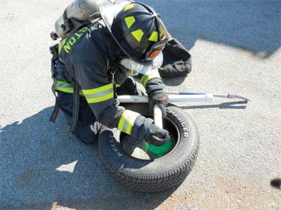 firefighter navigated the tires and is assembling the PVC pieces