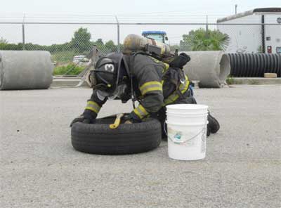 (5) A participant used his tool to mark the direction of the next tire before committing himself to retrieving the PVC part from the tire