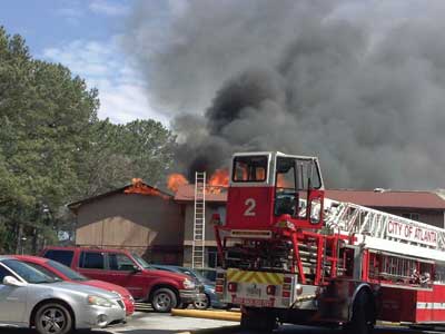 (4) Note the fire's extension to the attached exposure on the left.