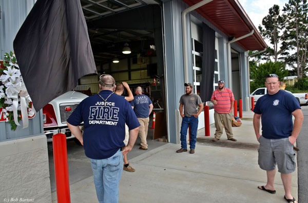 Firefighters at the Justice Fire Department station readying for the funeral for their fallen comrade.