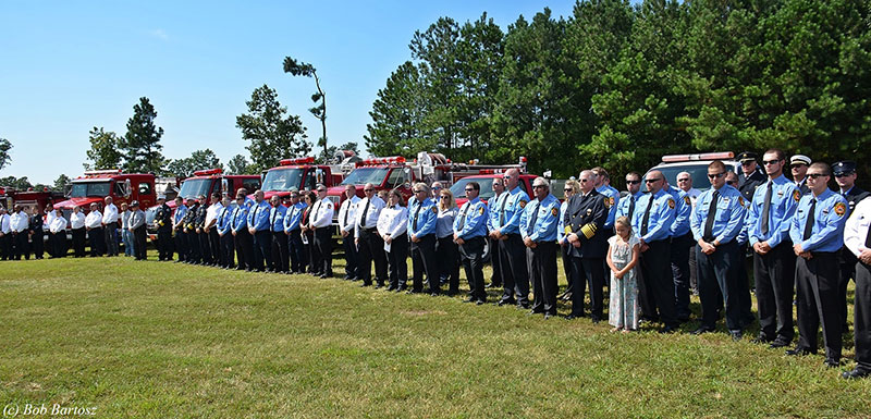 A mass of firefighters arrayed at the funeral site.