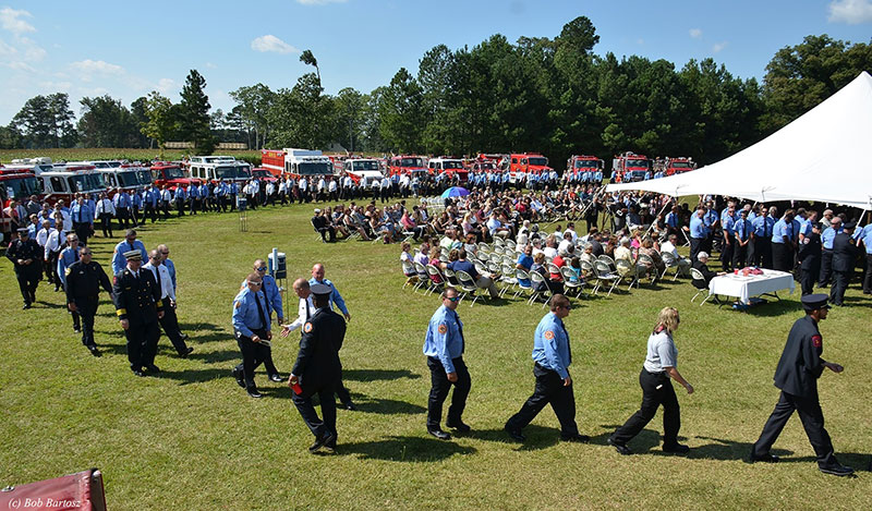 Mourners arrive at the service.