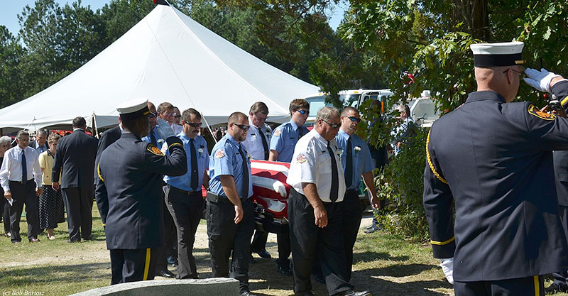 The casket is brought forward.