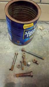 coffee can full of five to six sets of different-size nuts and bolts