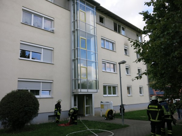 Side A of the fire building during overhaul.