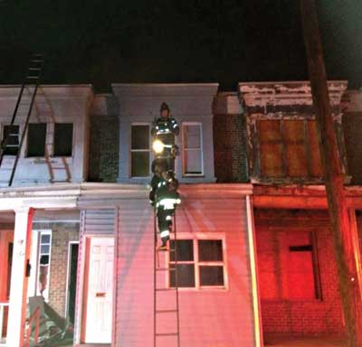 (6) One option for securing a ladder for safe climbing is to hold the tip at the top as another ladder firefighter climbs.