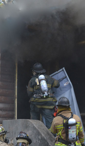 Firefighter deploying curtain