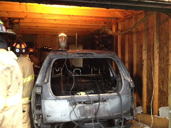 A view of one of the vehicles burned in the garage.