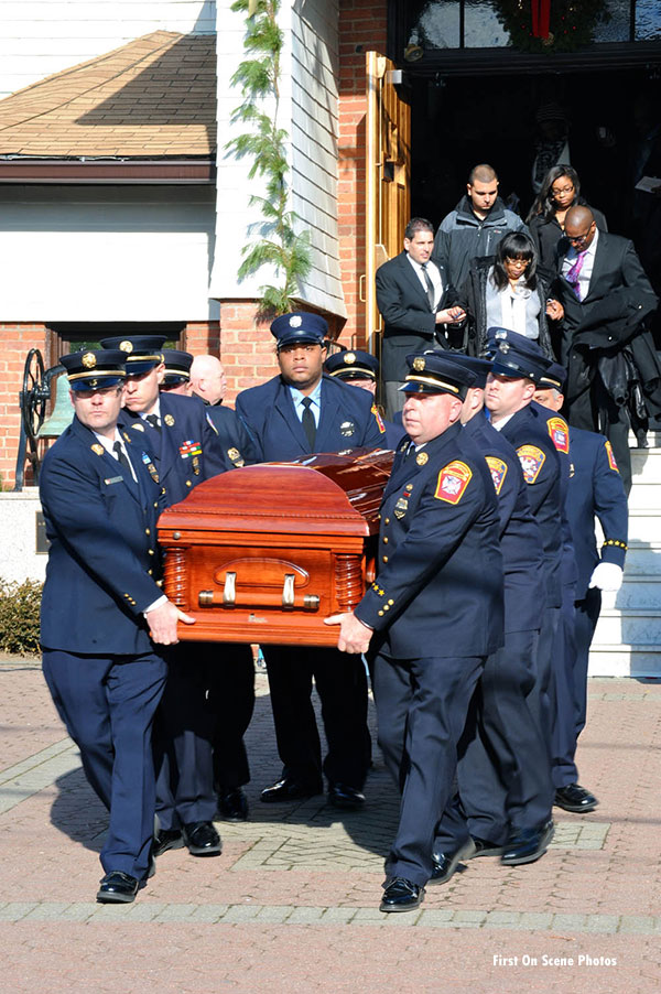 Sanford's casket is removed from the church.