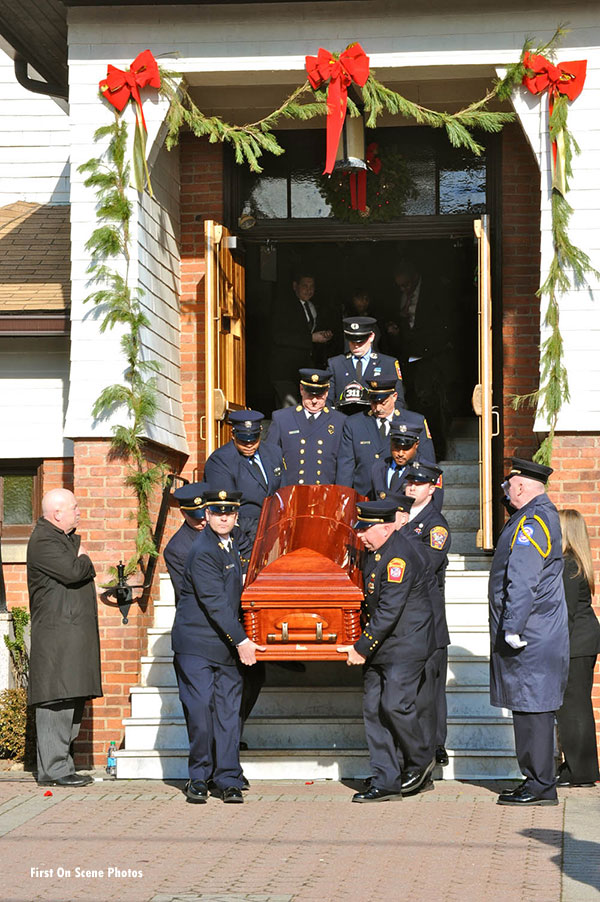 Sanford's casket is brought forth from the church.