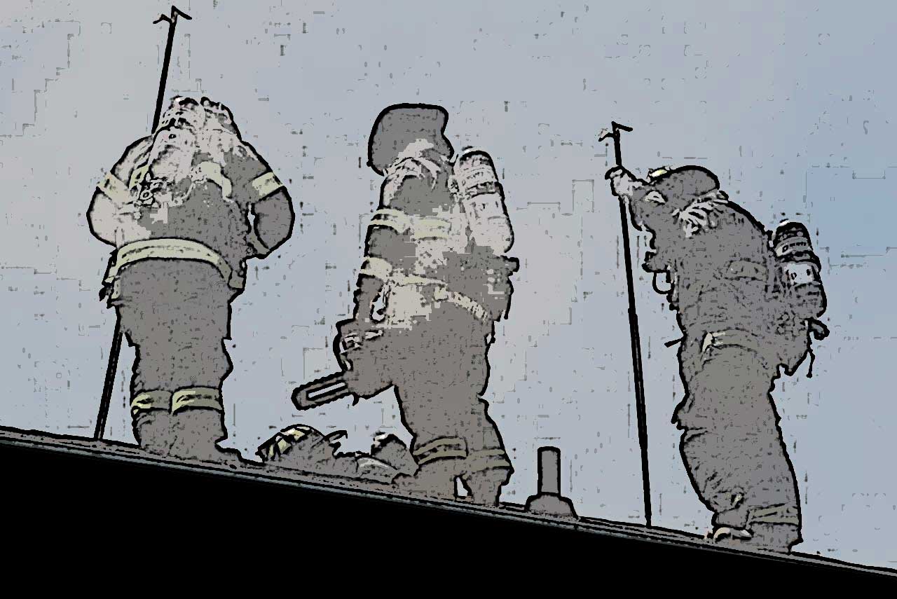 Firefighters on a roof with tools