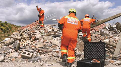 Rescue team members perform a search.