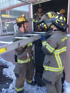 (10) Maintaining an underhand grip will help the firefighters support and lower the ladder.