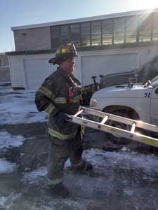 (12) The firefighter switches his hands from the rungs to the rails after pulling to help during the lower/pivot motion.