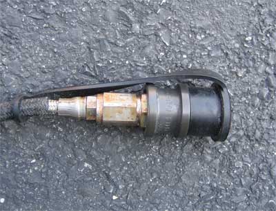 (2) This relatively new SCBA connection was damaged by a single exposure to chlorine during a structure fire.