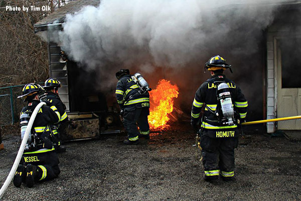 Firefighters battle a wind-driven garage fire in Lake Villa, Illinois.