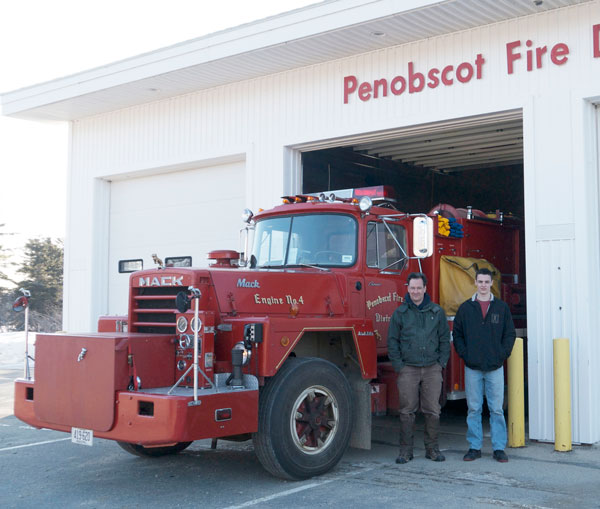 Hugh Evans and Alex Turanski with the company's old rig.