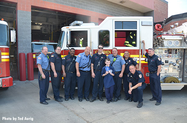 Riley Carty vsiited with Camden (NJ) firefighters during a visit to Liberty Station.