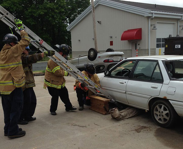 Paul DeBartolomeo and company demonstrate a new training evolution for extrication a patient trapped under a car.