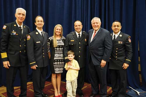 (1) After the award presentation. (l-r): Chief Bobby Halton, Battalion Chief Chuck Downey, Sean Killelea and family, CEO of PennWell Publishing Corp. Robert Biolchini, and Battalion Chief Joseph Downey.<i> (Photos by Tony Greco.)</i>