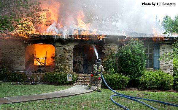 Structural Firefighting: Escambia County (FL) firefighters respond to a house fire.