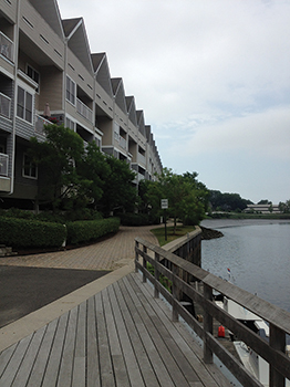 (6) Fire apparatus have limited access to the rear balconies of this apartment building.