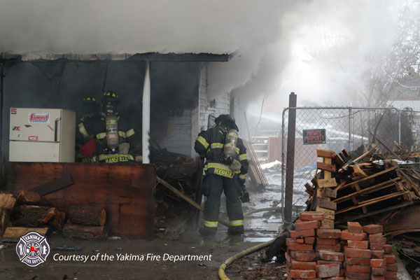 Firefighters prepare to enter the IDLH environment at a structure fire.