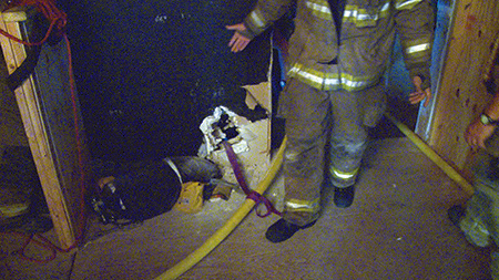 (5) We anchored the hose with a clove hitch. Not pictured is the girth hitch on a halligan tool on the other side of the wall.