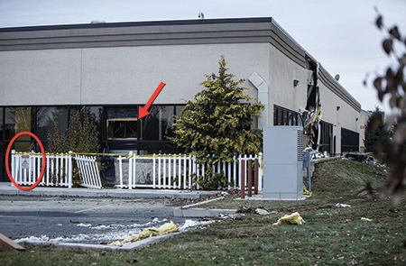 (4) The side C/D corner. The sign on the fence warns of the presence of a magnetic field (circle). A firefighter made entry through the window (arrow), and the magnetic field pulled his halligan from his hands.