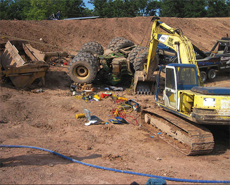 (2) The four-point stabilization system included a backhoe, two wreckers, and a John Deere 9360 tractor.