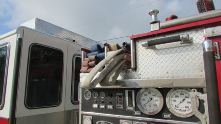 This is the finished flat load with strategically placed loops. Note that the backup loop is under the nozzle firefighter loop and the location of the nozzle.