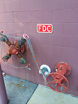 (3) This is a common exterior connection setup. It includes a fire pump test header with four male-threaded 2½-inch connections, a typical double 2½-inch female-threaded FDC, and a control valve.