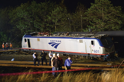 (10) Continuous size-up of the extensive scene revealed many challenges that taxed emergency responders' resources. The locomotive came to rest approximately 150 feet beyond car 1, near where rail tank cars were stored. This tank car that impeded access to the scene was later moved away. 