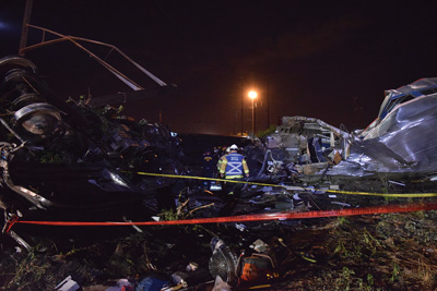 (3) Shutting down all rail traffic and electrical power to Amtrak's busy Northeast Corridor was among the initial incident objectives. The safety officer surveys the wreckage of car 1, the most severely damaged.