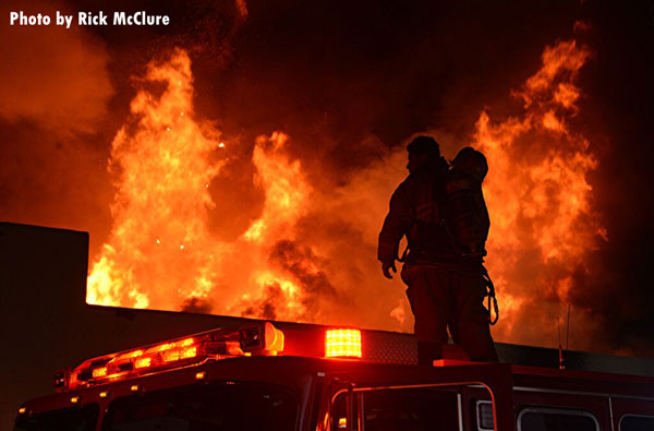 Firefighters confront a raging commercial fire in Hungtington Park, California.