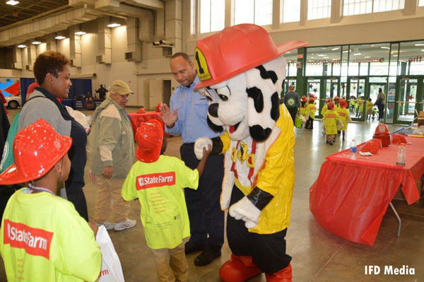 A mascot greets students participating in the Annual Fire Safety Olympics in Indianapolis.