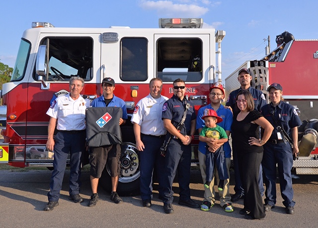 Members of the San Marcos (TX) Fire Department partnered with Domino’s Pizza to deliver orders and check smoke detectors during Fire Prevention Week