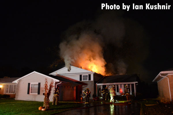 Fire shoots from the roof of a home in Allen Park, Michigan.