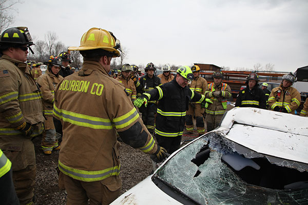 Firefighters listen during an extrication training evolution.