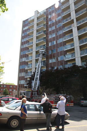 (2) Stopping just short of your final position and having the spotter “walk” the apparatus into its final position save time in repositioning. They save time because the driver may have a hard time assessing obstructions from the cab.<i> (Photo by author.)</i>