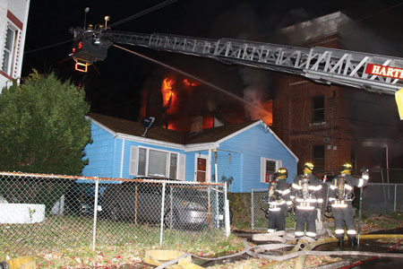 (3) The apparatus has been positioned at the corner of the fire building outside of the collapse zone and in a position to protect the most severely threatened exposure.<i> </i>