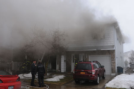 (1) The fire was in a two-story semiattached private dwelling; it started on the first floor. <i>(Photos by Steve White.)</i> 