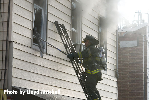 FDNY outside vent man working on horizontal ventilation during a Brooklyn fire.