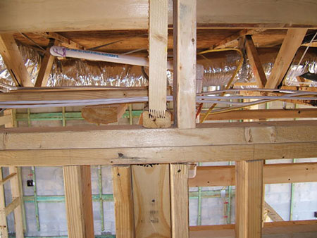 (4) Finger joint trusses. There is less mass, less connection integrity, and more glue. (Photo by John Mittendorf.)