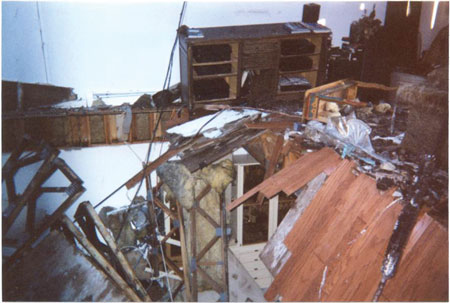 (7) Unburned trusses that were ripped from the truss loft as the roof and floors above collapsed on top of them.