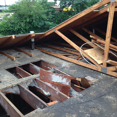 (1) Compare the original flat roof joists and the lightweight renovated peaked wood roof trusses. Which would you rather work on?<i> (Ph</i>otos by author unless otherwise noted.)