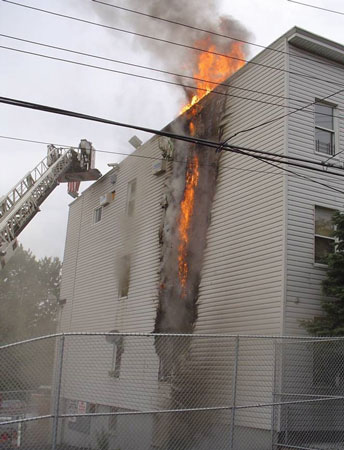 (1) “V” pattern forming on the outside of a building. It produces an arrow that points to the room where the fire started. <i>(</i>Photos by author unless otherwise noted.)