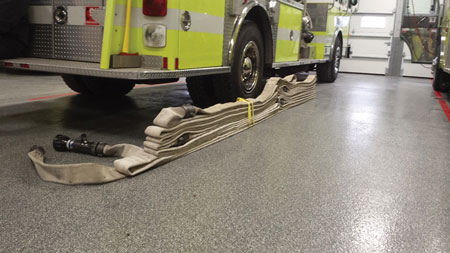 (5) This DL Blitz Load is packed for deployment on the apparatus floor. Note the tail end of the male coupling, which connects to the 2½-inch discharge on the rear of the apparatus and then runs one full length, creating the bottom layer that begins at the rear of the 150-foot flat load. If the 2½-inch discharge was located in your hosebed near the pump panel, the bottom layer of hose would not exist from the rear; it would be the beginning of the 150-foot flat load connected to the discharge by the pump panel.  