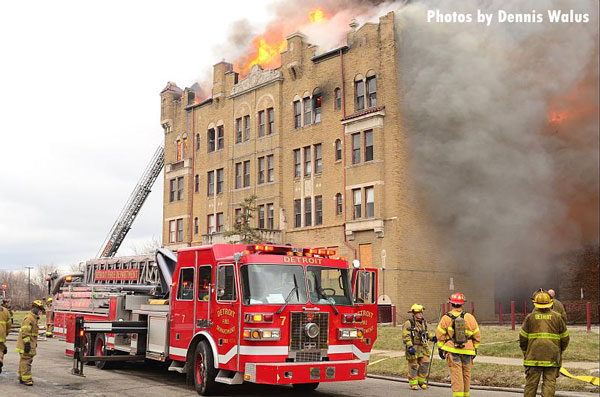 Detroit fire apparatus and firefighters at the scene of a fire in a five-story Highland Park (IL) apartment building.